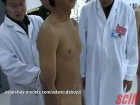 Medical examination of an Asian twink by an army medic.