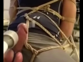 Gay Asian bondage scene ends with a facial