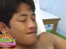 Young Asian man enjoys anal sex