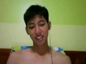 Young Thai webcam performer masturbates and ejaculates.