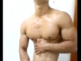 Asian hunk showing off his muscles